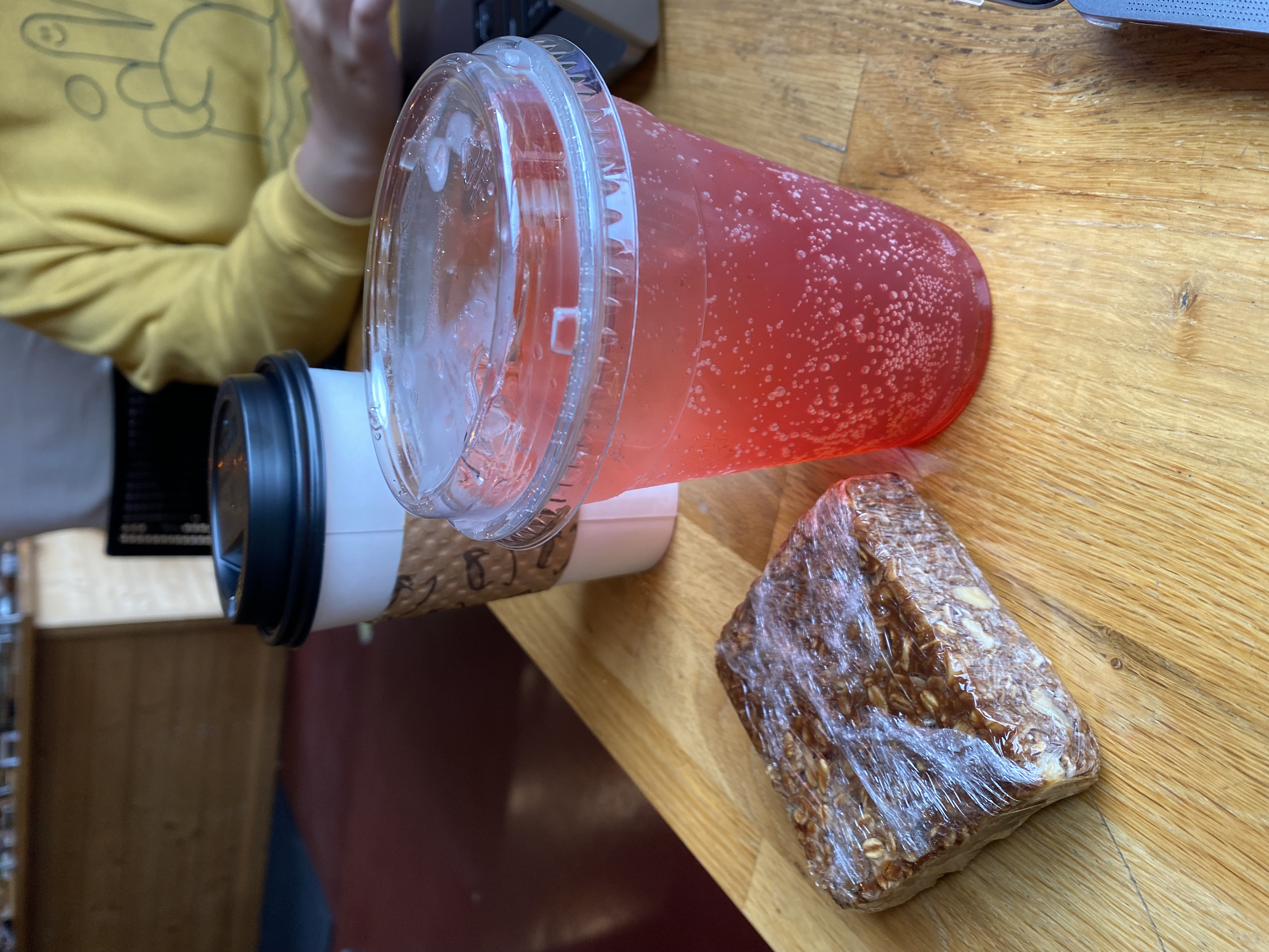 rasperry rose energy drink, granola bar, and coffee